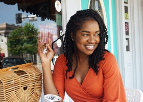 Smiling woman sitting outside