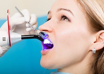 Woman receiving dental bonding treatment