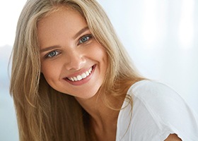 patient smiling after getting dental implants in Crown Point