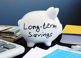 a piggy bank with the words “long-term savings” written on it