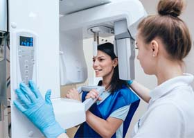 Woman at Cone Beam Scanner in Crown Point