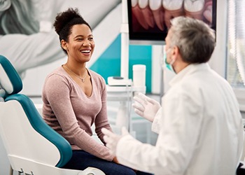 Dentist and patient talking in the treatment room