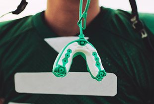Green and white sports mouthguard
