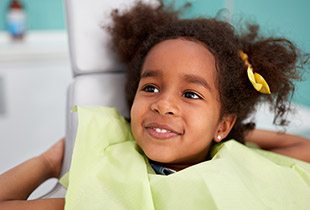 Smiling little girl relaxed at dental office for children's dentistry