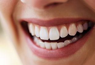 Closeup of healthy smile after gum disease therapy