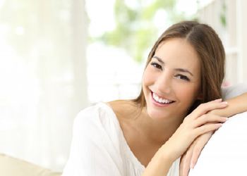 Woman with porcelain veneers smiling