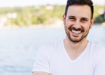 Man with porcelain veneers smiling