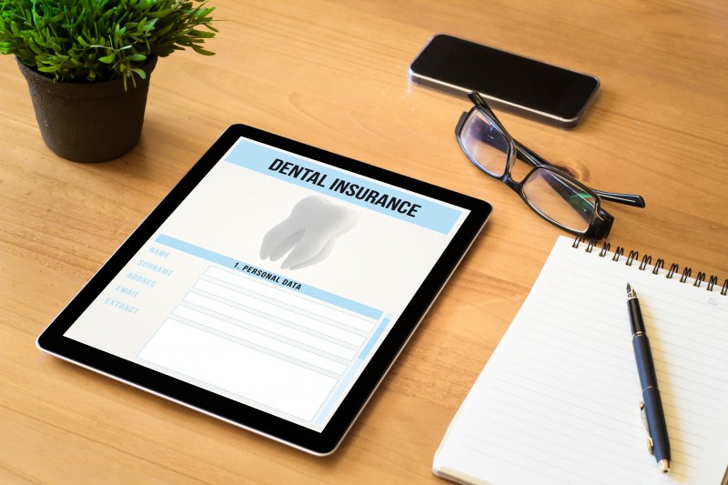 Tablet on desk with dental insurance form