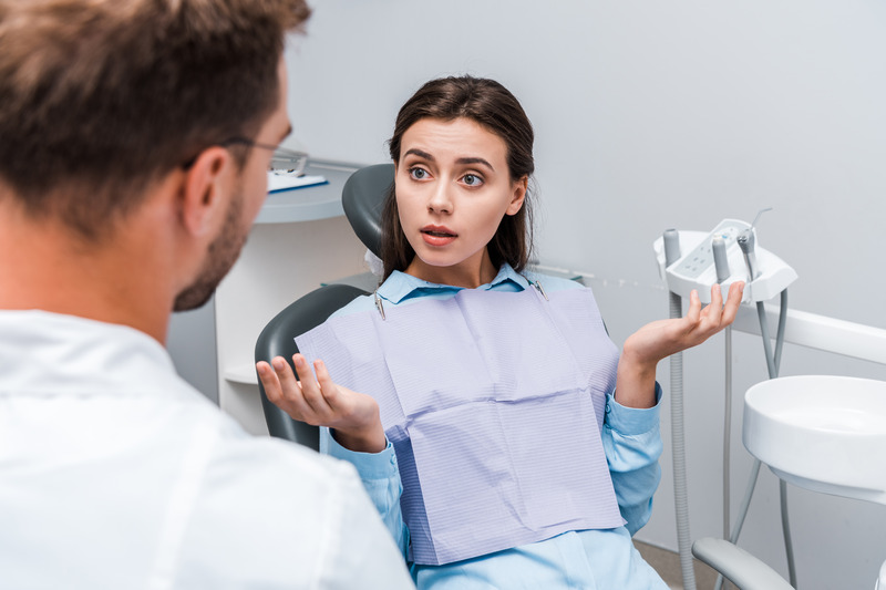 Patient talking to dentist about oral cancer
